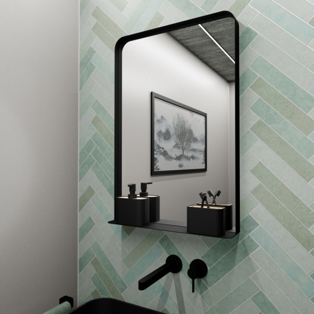 Lifestyle image of the Origins Living City Shelf 500mm x 750mm Black Mirror mounted on a green tiled bathroom wall in front of a basin CTY-002057-BK